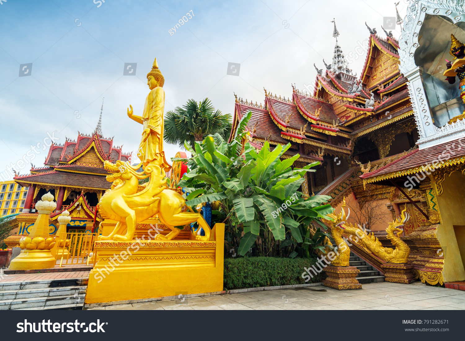 figure of Buddha and Buddhist palace in Xishuangbanna China