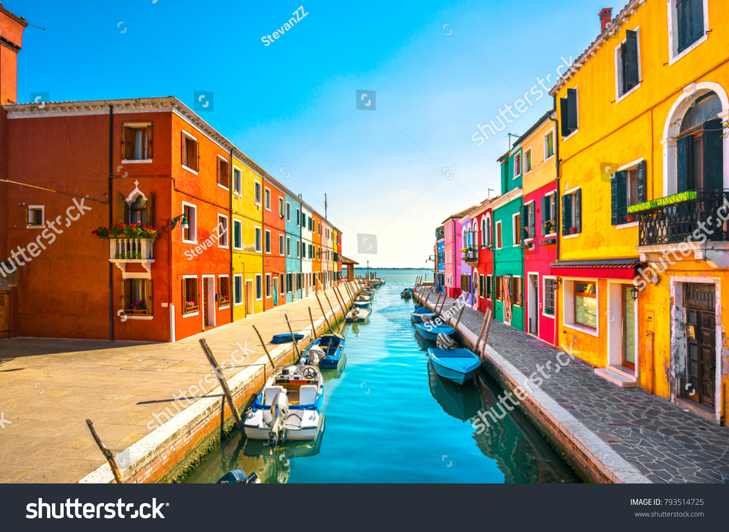 Burano island canal  colorful houses and boats  Venice Italy Europe