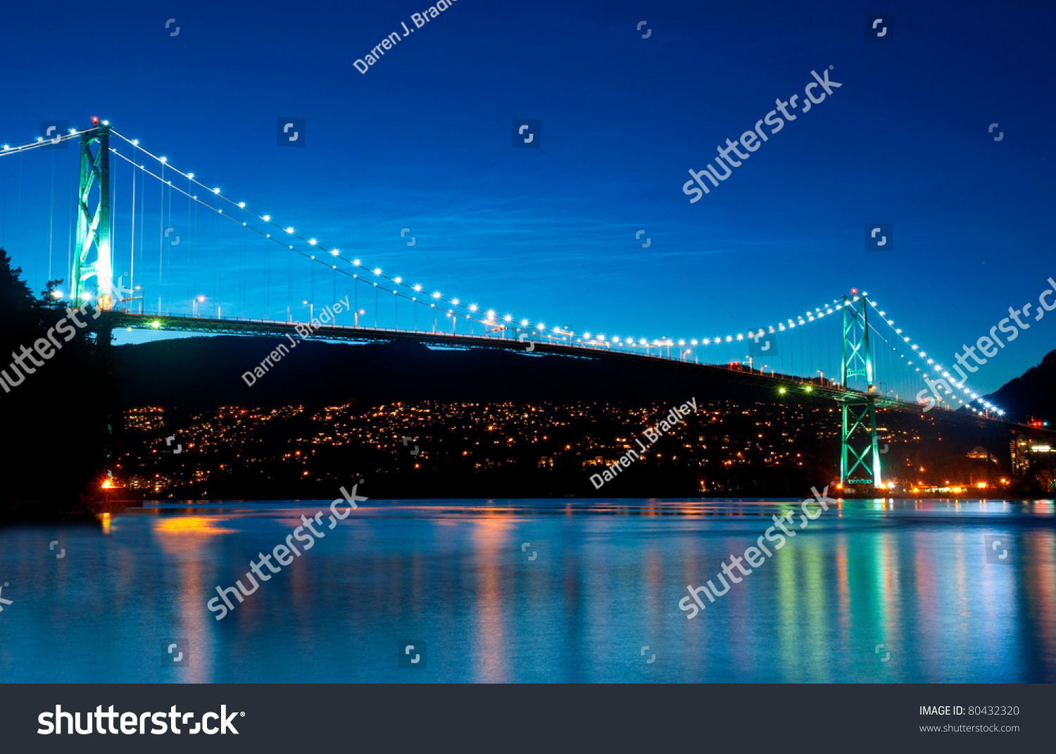 The Lion's Gate Bridge in Vancouver  British Columbia during an evening blue hour.
