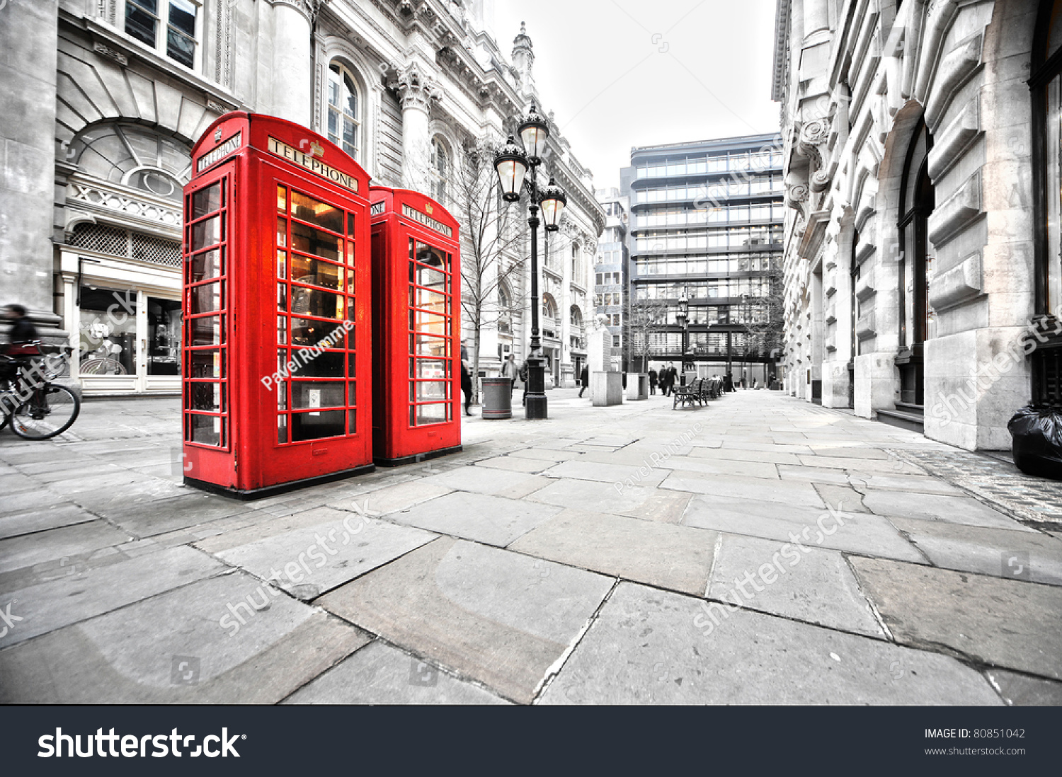 two red phone booths on the street