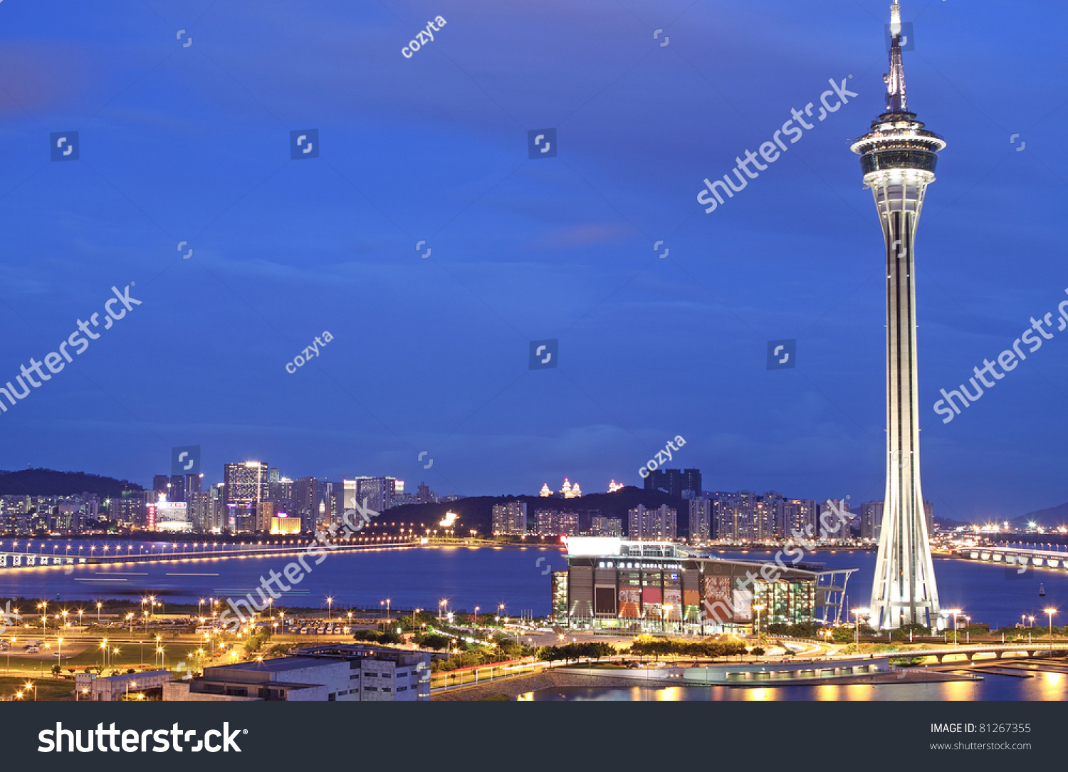 Urban landscape of Macau with famous traveling tower under sky near river in Macao  Asia.