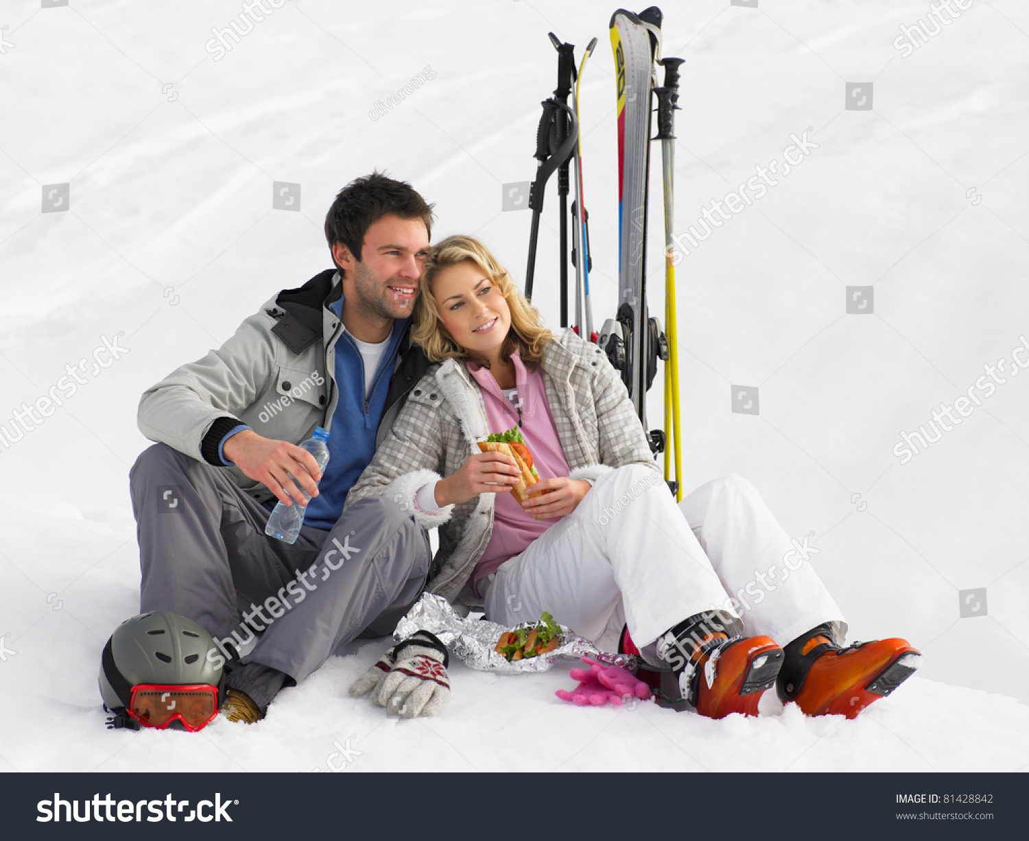 Young Couple With Picnic On Ski Vacation