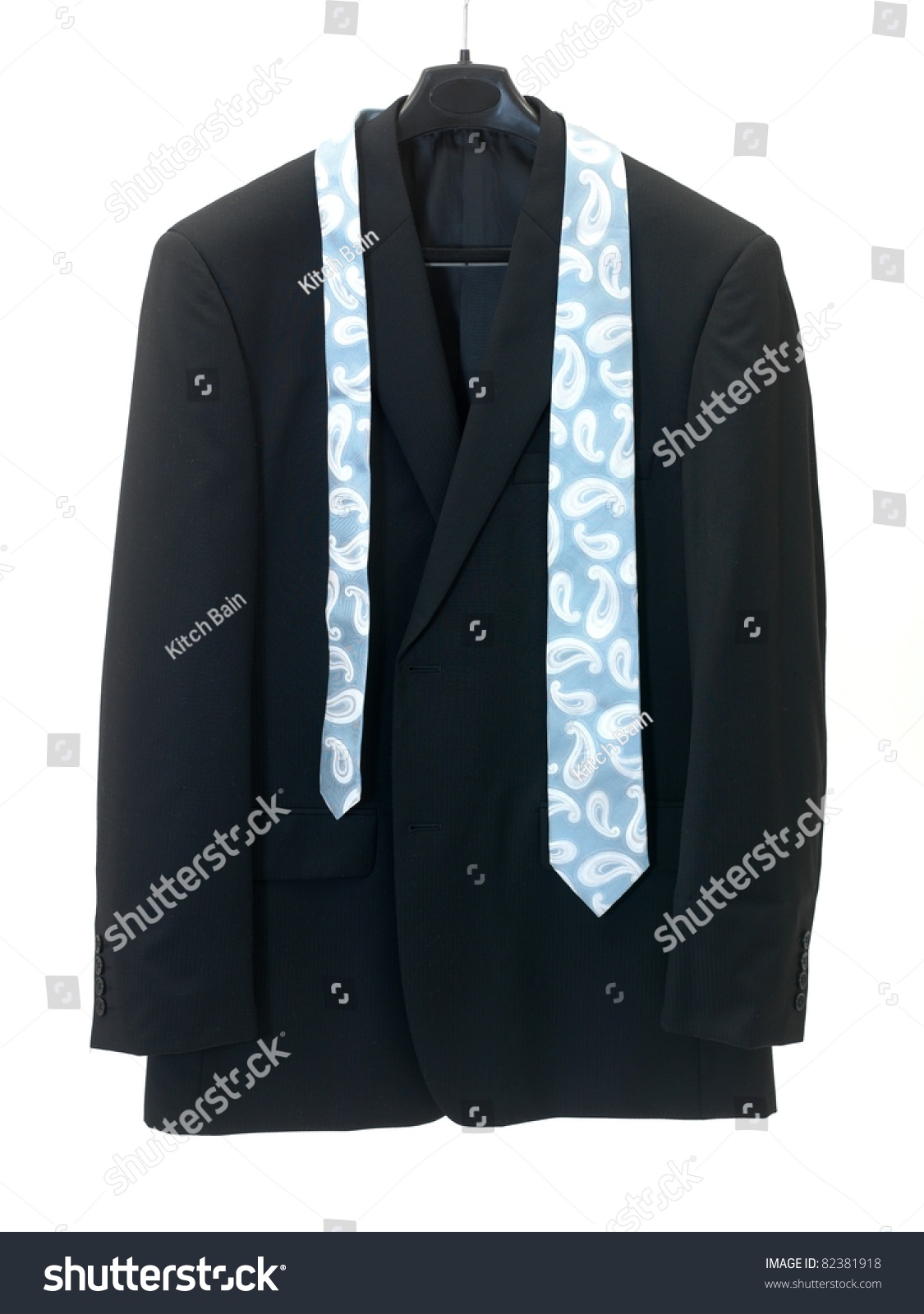 garmentshangingoncoathangerisolatedagainstawhitebackground