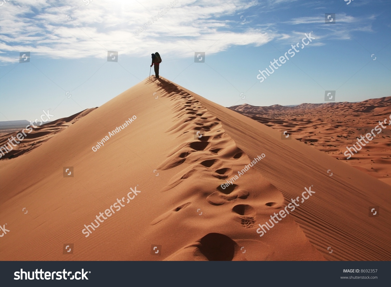 Man go up in sand desert