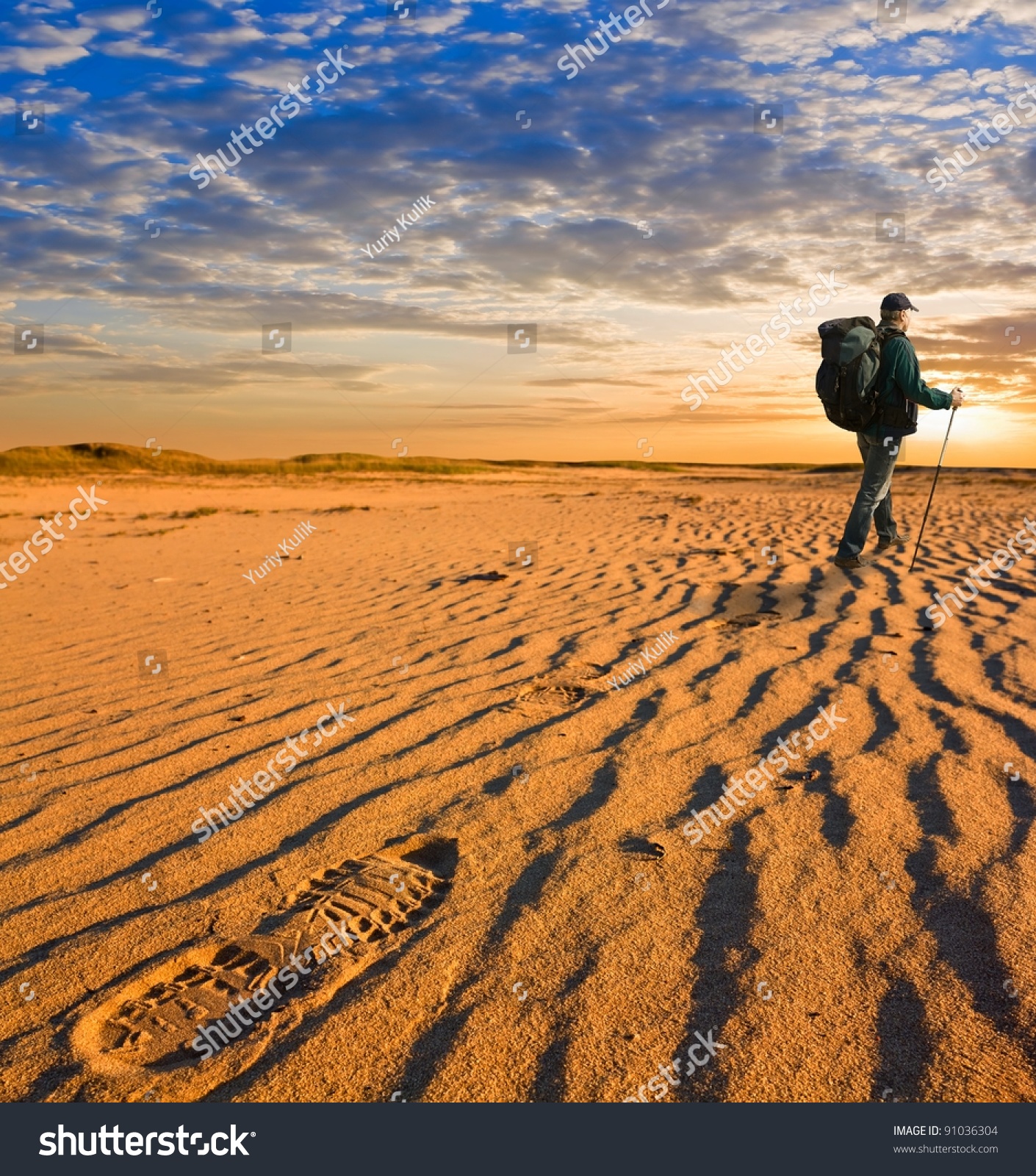hiker walk in a hot sand desert