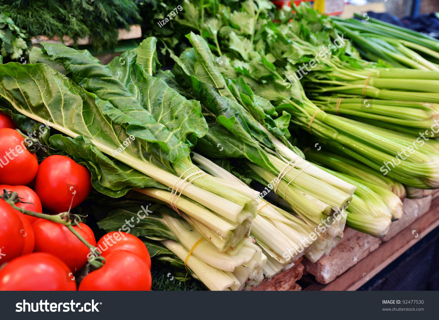 close up of salad and tomatoes on market stand