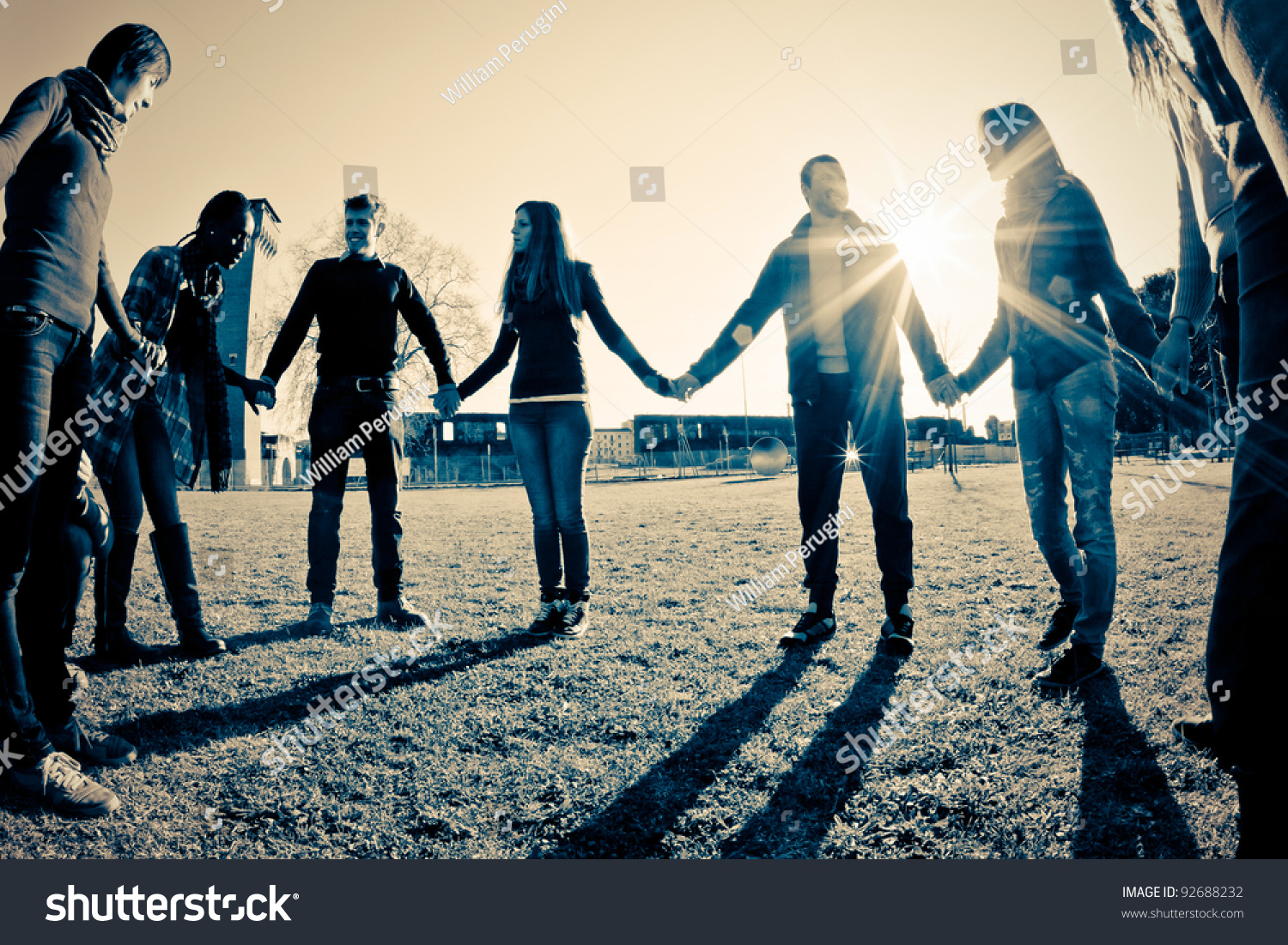 Multiracial Young People Holding Hands in a Circle