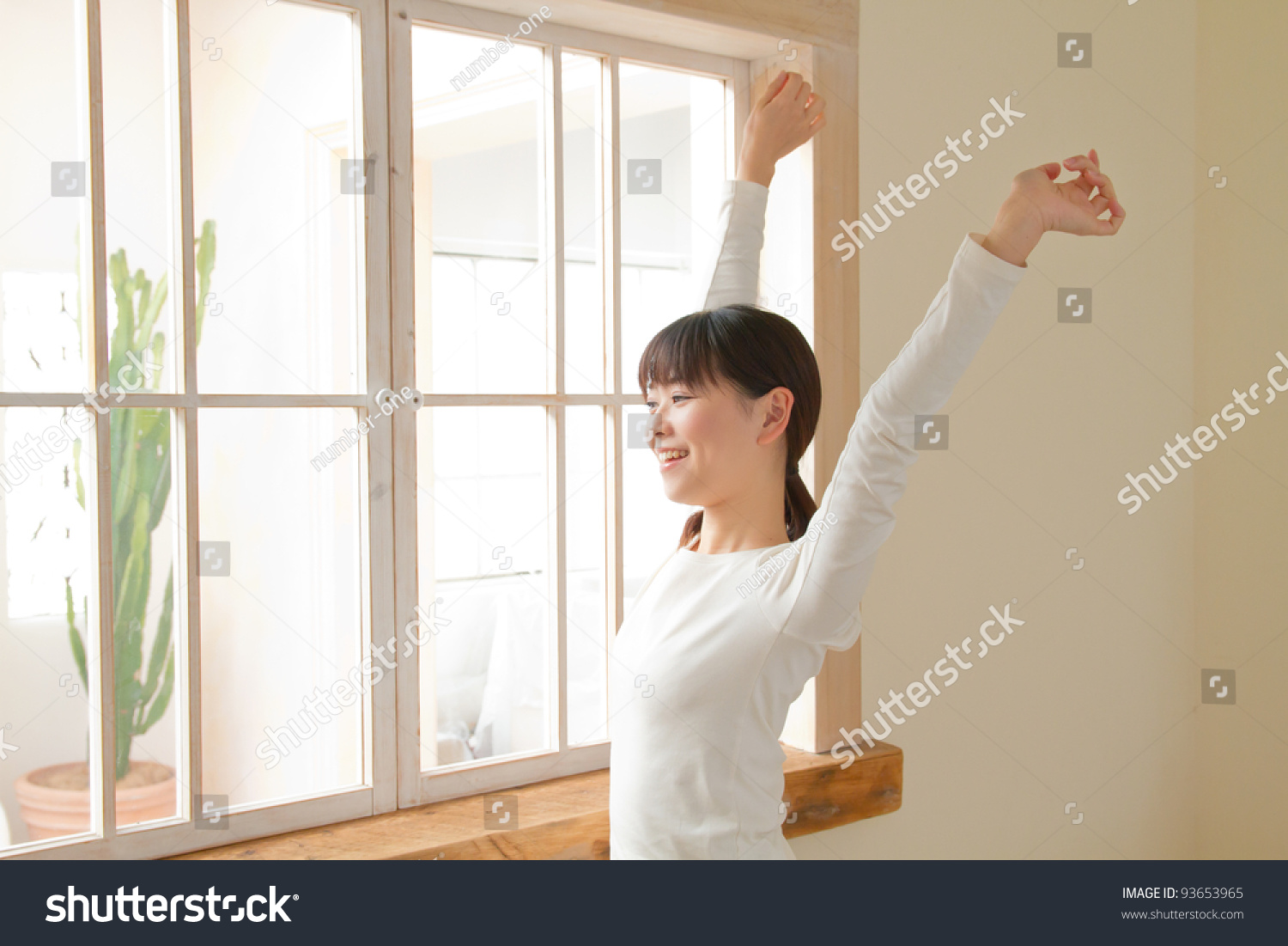 Beautiful young woman relaxing in the bedroom. Portrait of asian woman