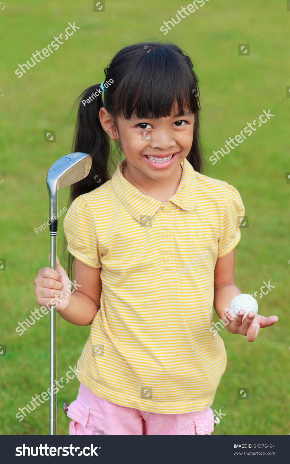 Smiling little girl at golf club