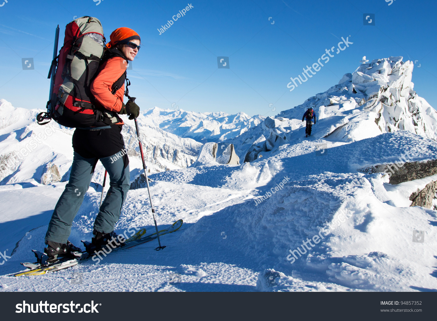 Young woman doing ski touring in winter Alps