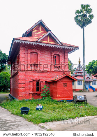 an old british colonial style building built with red bricks