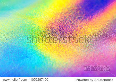 Rainbow leather real holographic foil texture background with vibrant trendy neon colors.