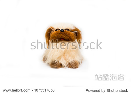 yellow and brown dog toy on white background childhood and fun