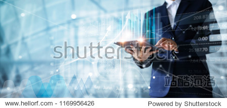 Businessman using tablet analyzing sales data and economic growth graph chart. Business strategy. Abstract icon. Digital marketing.