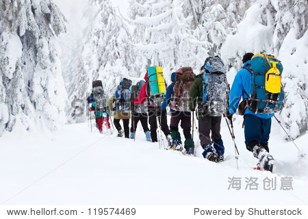 group of hikers in winter mountains