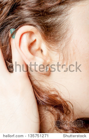 young caucasian woman ear closeup.