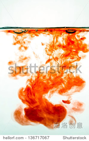 red ink in colored water on white background.