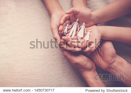 Adult and children hands holding paper family cutout family home foster care homeless support international day of families concept