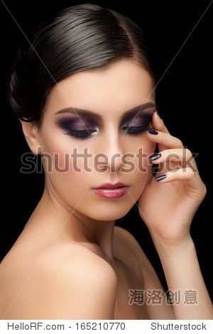 fashion studio shot of young beautiful woman with bright violet