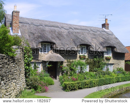english thatched cottage at thornton dale, yorkshire, england