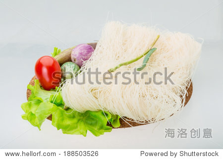 raw rice noodles with asparagus and vegetables
