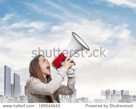 angry young woman shouting with a megaphone