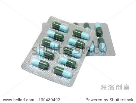 green and light blue capsule in transparent blister pack