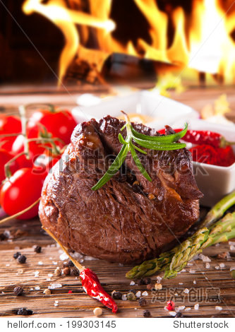 grilled fresh beef steak with flames.