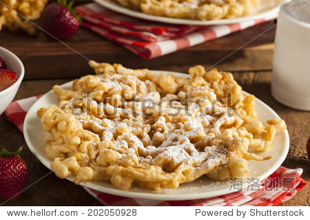 homemade funnel cake with powdered sugar at the fair