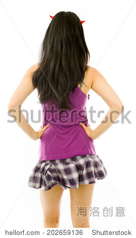 rear view of a asian young woman dressed up as a devil standing