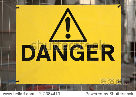 yellow danger sign on construction site