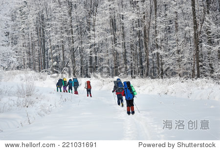 Team of hikers in winter mountains
