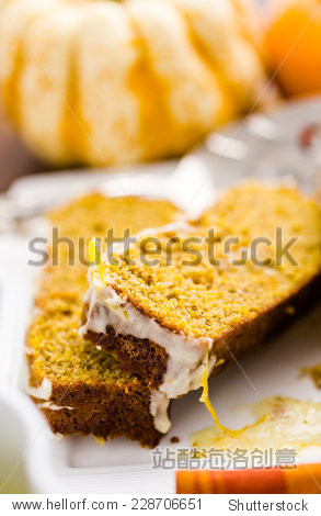 homemade pumpkin bread with orange glazing on top.