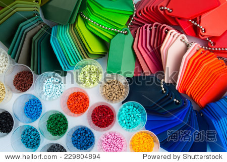 several dyed plastic polymer granulates in laborato