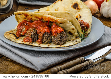 indian naan with meatballs and tomato sauce, spicy sauce and