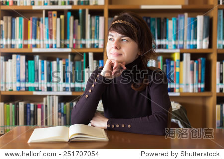 beautiful student girl studying in college library.