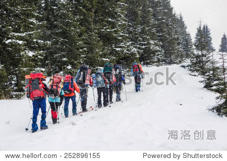 group of hikers in winter mountains 