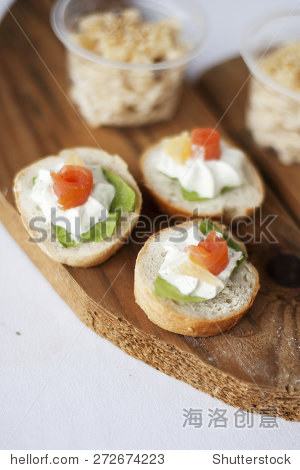 canapes with small bread chess and salmon.