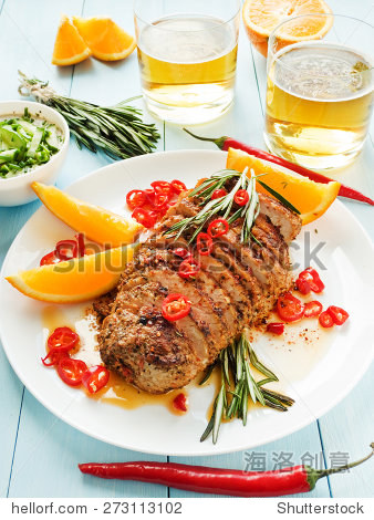 argentinian asado pork fillet with herbs, oranges and sauce.