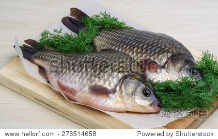 two crucian with dill ready for cooking