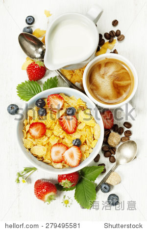 healthy breakfast with coffee, corn flakes, milk and berry on