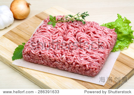 minced meat served thyme, onion and garlic - ready for cooking