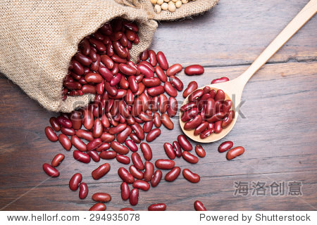 portion of dried red beans on wooden background