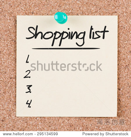 reminder sticky note on cork board with shopping list text