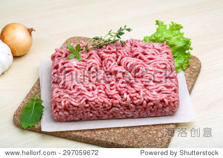 minced meat served thyme, onion and garlic - ready for cooking