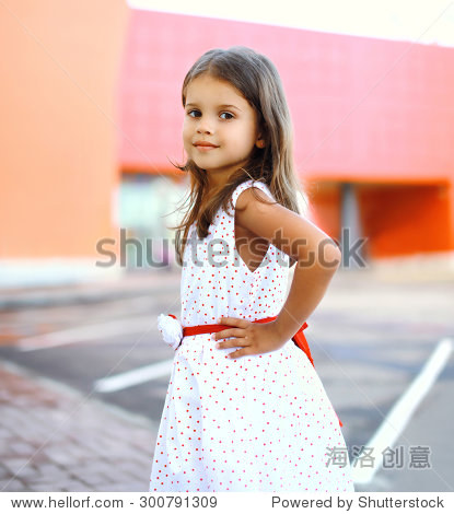 portrait of cute little girl wearing a dress in