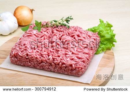 minced meat served thyme, onion and garlic - ready for cooking