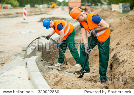 photo of labourers working on a road construction
