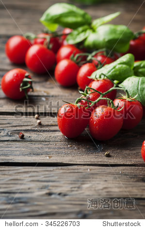 fresh sweet tomato and green basil on the vintage table