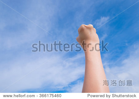 female clenched fist on blue sky background - 图片素材 - 站酷